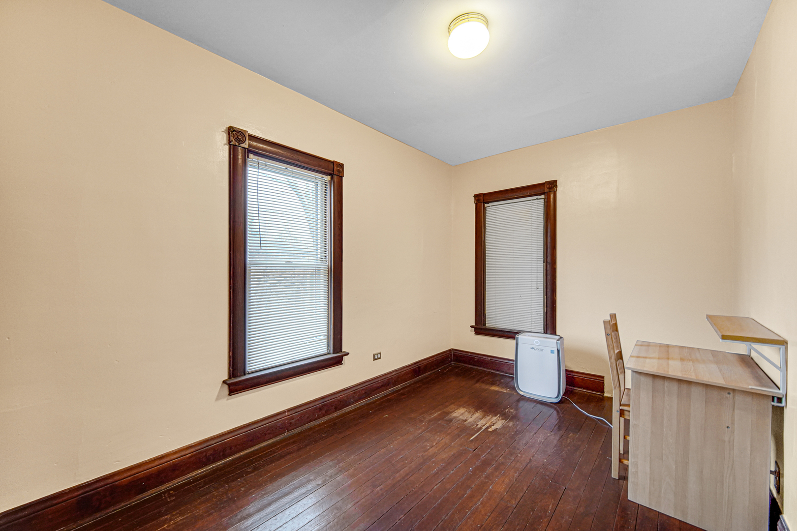1112 South Jefferson Street Lockport, IL 60441 - Photo 21 of 21 a view of an empty room with wooden floor and a window