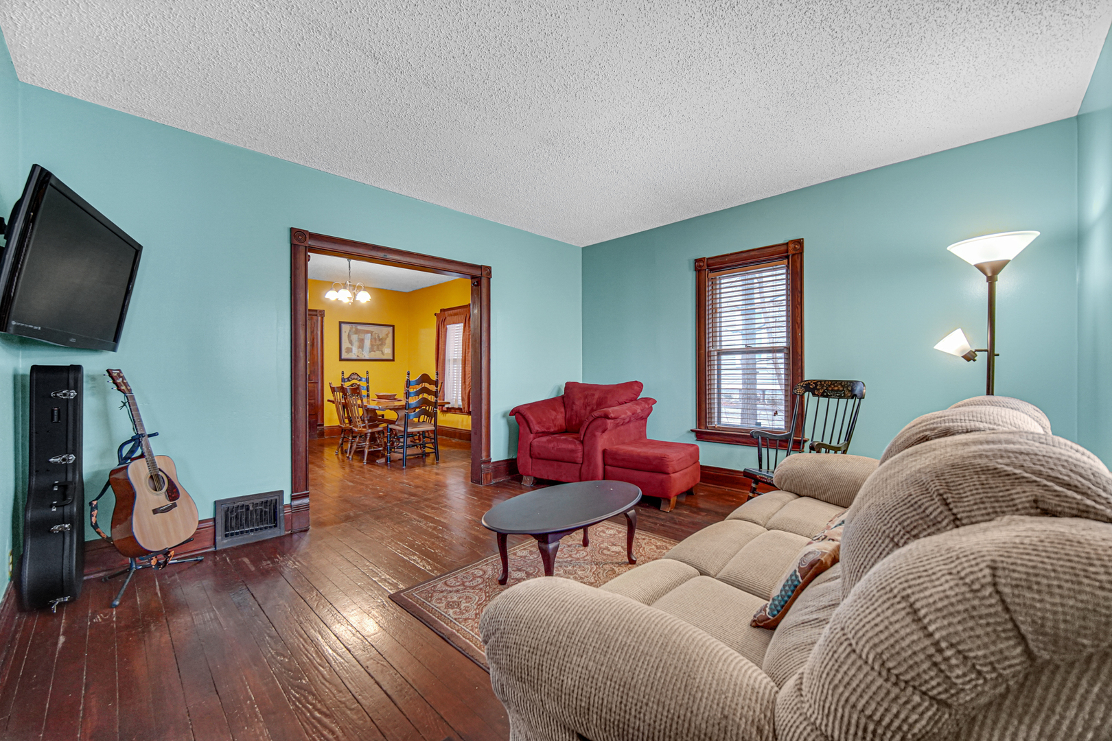 1112 South Jefferson Street Lockport, IL 60441 - Photo 8 of 21 a living room with furniture a ceiling fan and a window