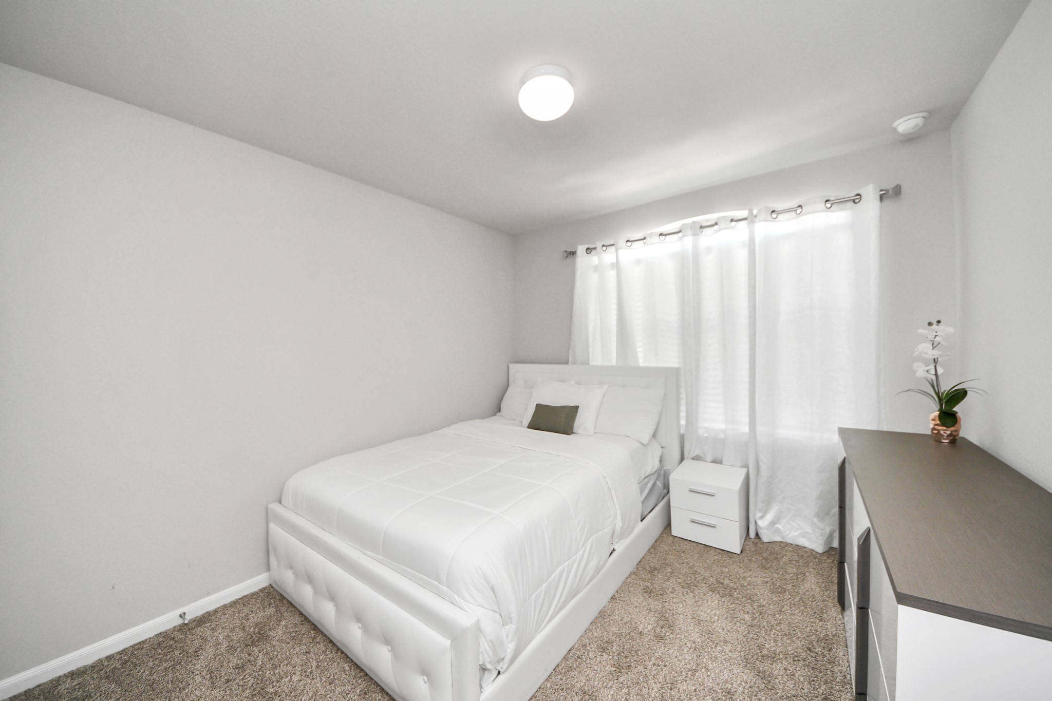 3514 Windham Way Katy, TX 77494 - Photo 12 of 42 a bedroom with a bed and a chair