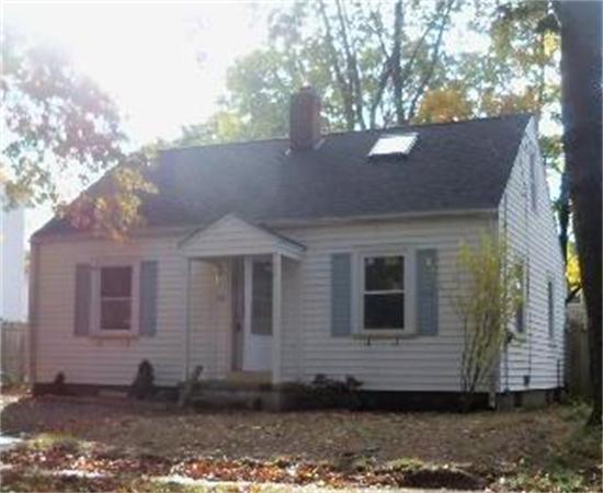 125 Merida Street Springfield, MA 01104 - Photo 1 of 1 a front view of a house with a yard