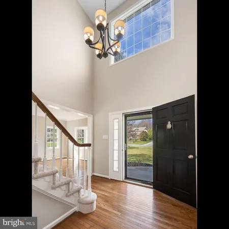 a view of entryway with wooden floor