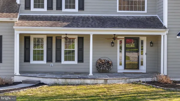 a view of a brick house with a swimming pool