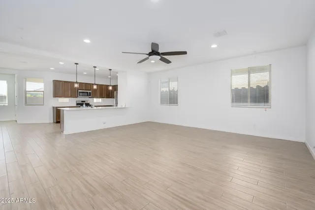 a view of a kitchen with a sink and a stove top oven
