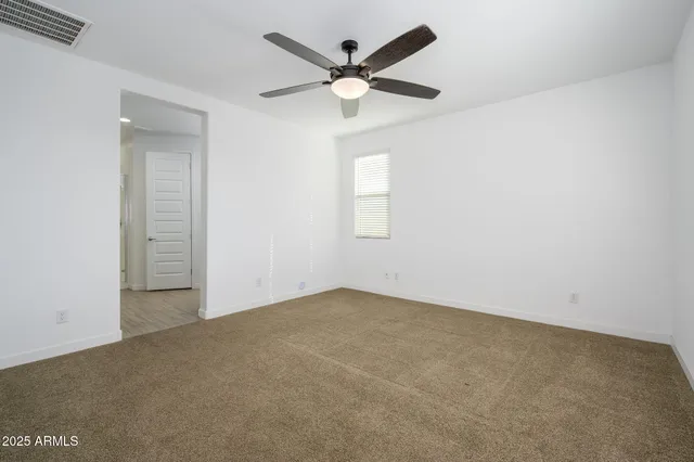 a bathroom with a sink double vanity granite and a mirror
