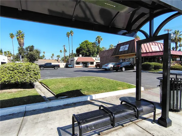a view of a backyard with sitting area