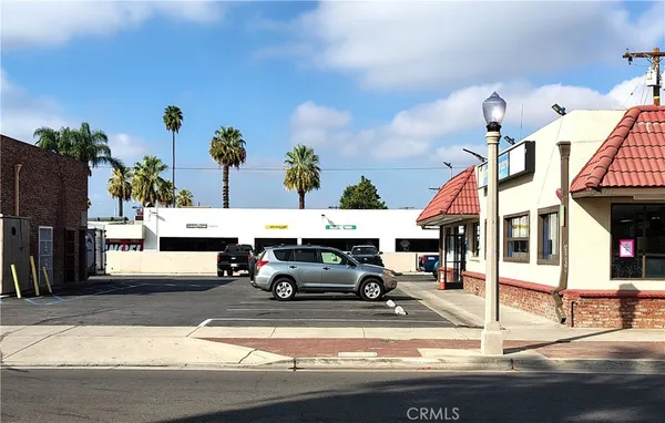 a view of parking with cars parked