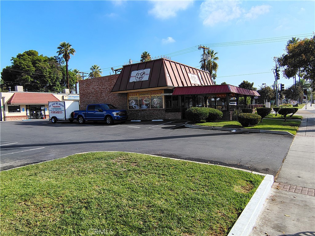 2115 University Riverside, CA 92507 - Photo 9 of 20 a front view of a house with a yard