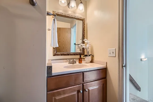 a bathroom with a sink and a mirror