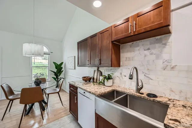 a kitchen with a sink cabinets and appliances