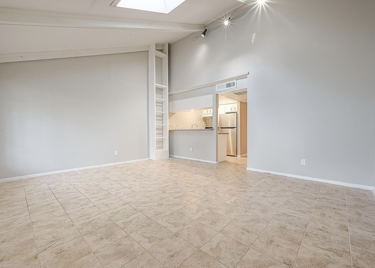1108 West Tri Oaks Lane, Unit 150 Houston, TX 77043 - Photo 7 of 26 a view of an empty room with a fireplace