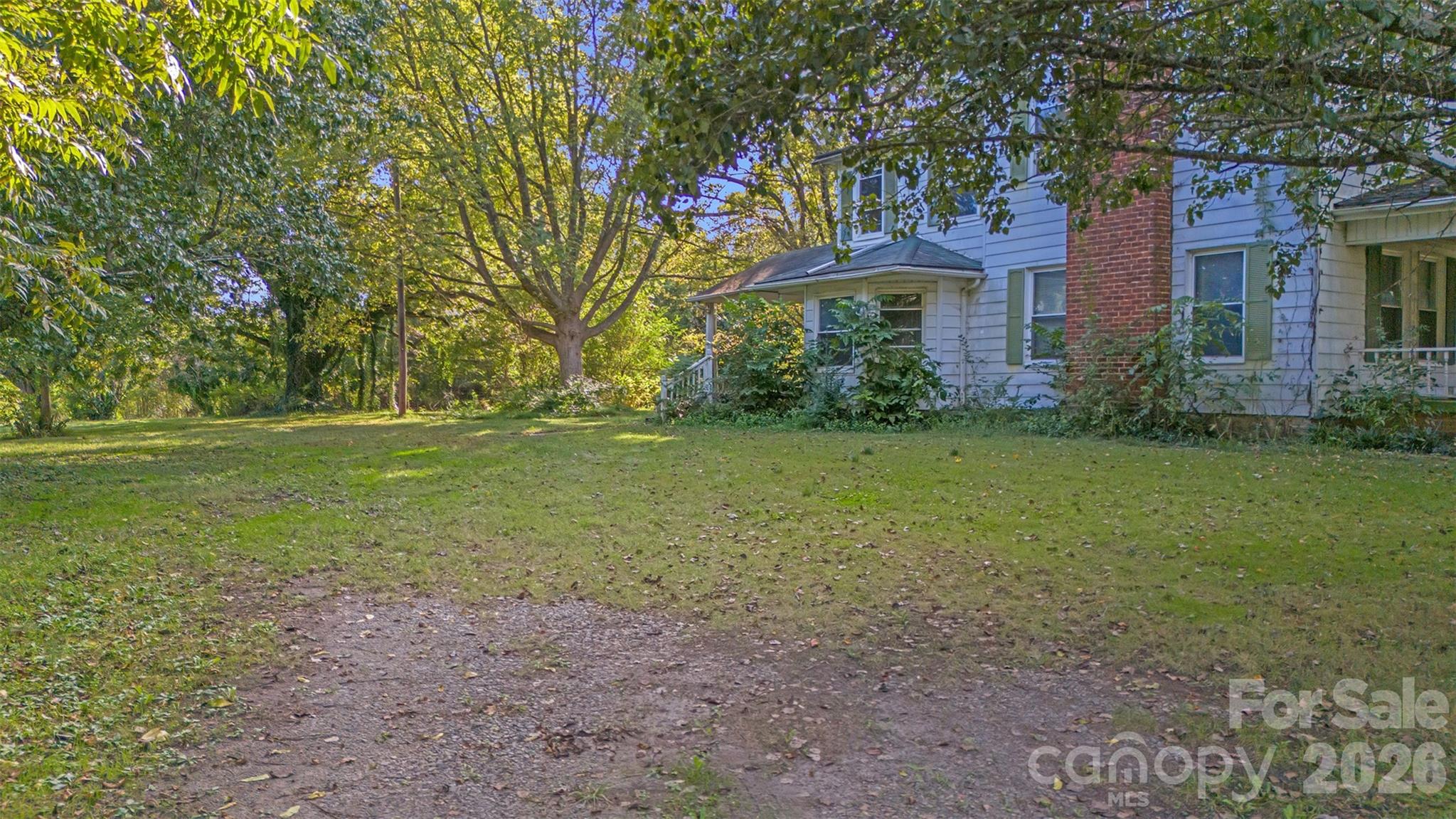 208 East Main Street Cleveland, NC 27013 - Photo 15 of 48 a view of a house with a yard