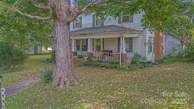 a view of a brick house with a yard