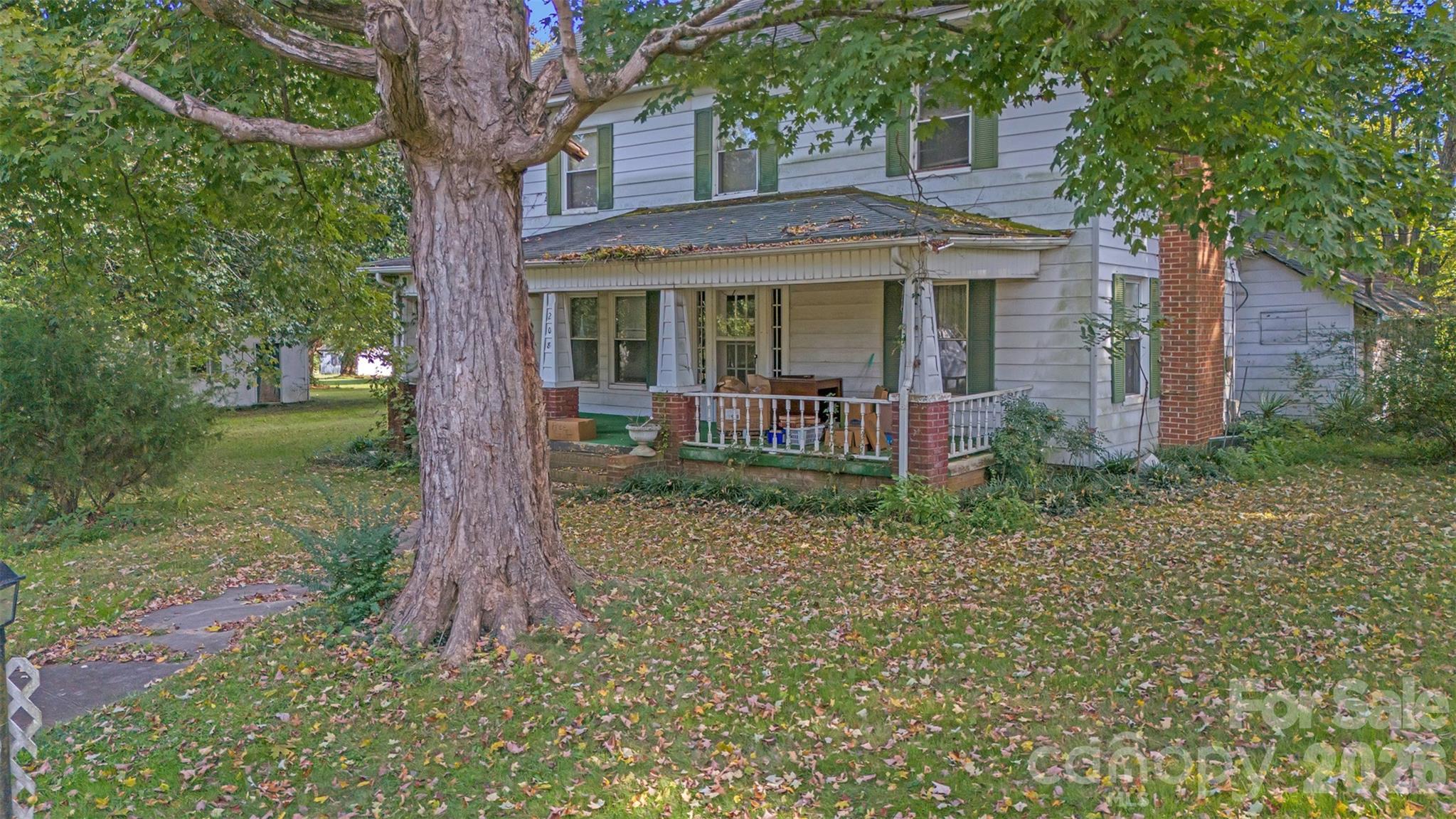 208 East Main Street Cleveland, NC 27013 - Photo 17 of 48 a front view of a house with garden