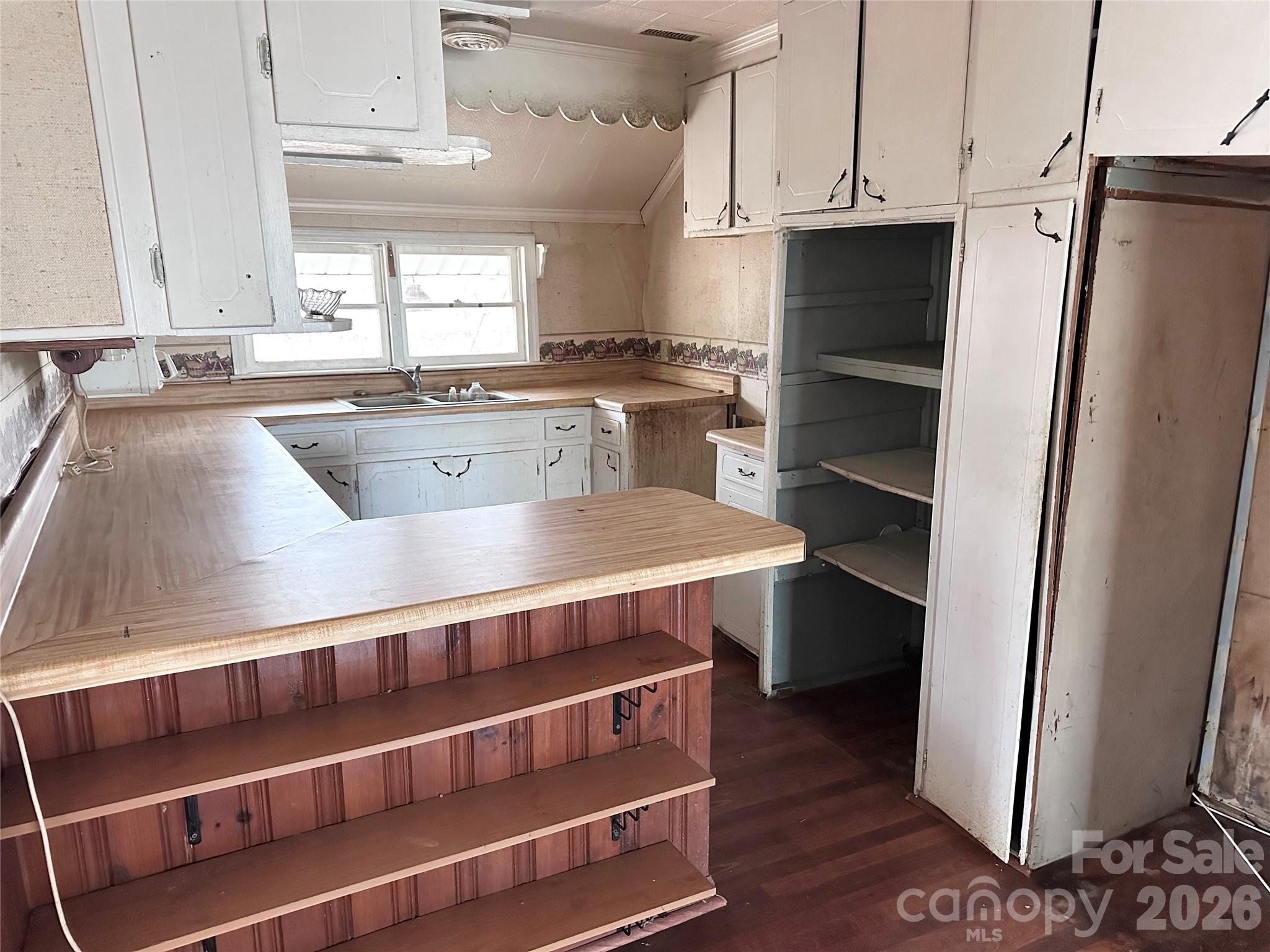 208 East Main Street Cleveland, NC 27013 - Photo 35 of 48 a kitchen with stainless steel appliances and a refrigerator