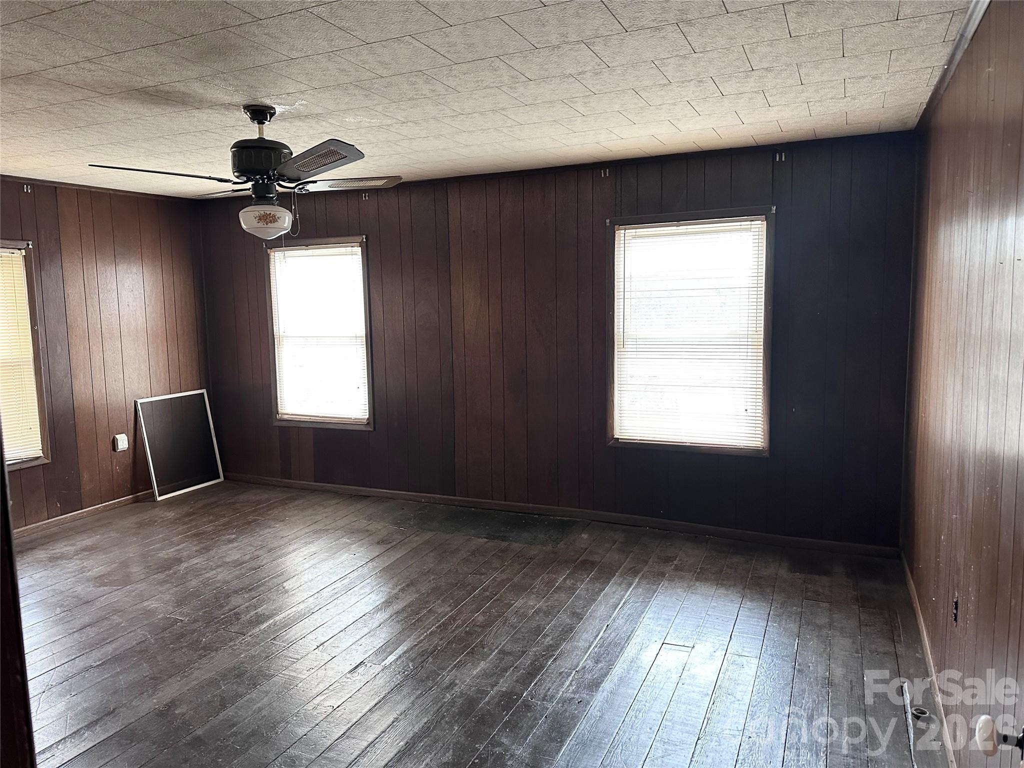 208 East Main Street Cleveland, NC 27013 - Photo 45 of 48 a view of an empty room with a window and wooden floor