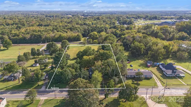 a view of a bathroom with a sink and a mirror