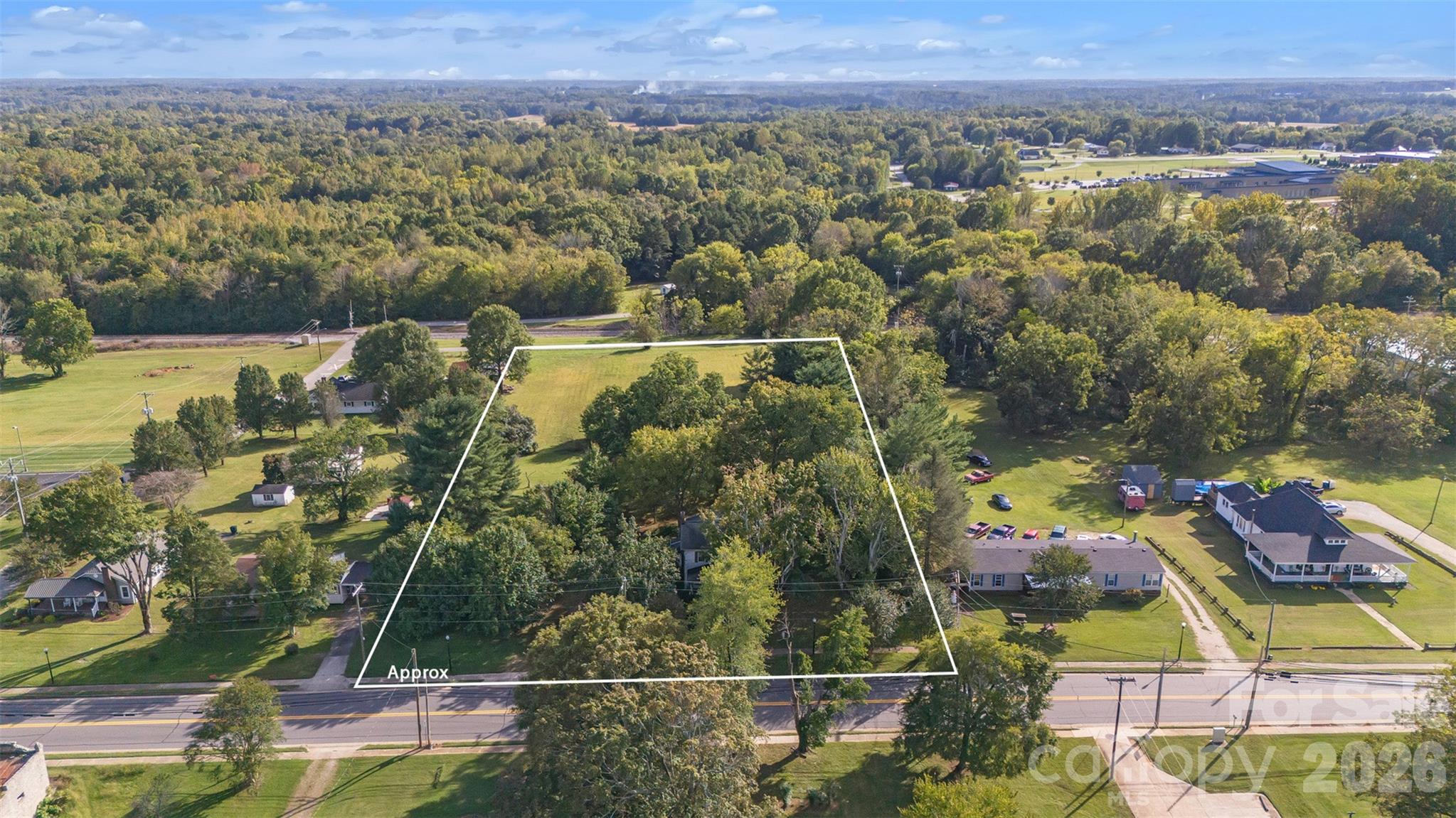 208 East Main Street Cleveland, NC 27013 - Photo 9 of 48 an aerial view of residential houses with outdoor space