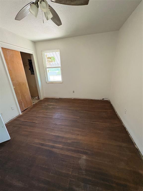 2306 Greenland Drive Dallas, TX 75228 - Photo 18 of 18 an empty room with windows and fan