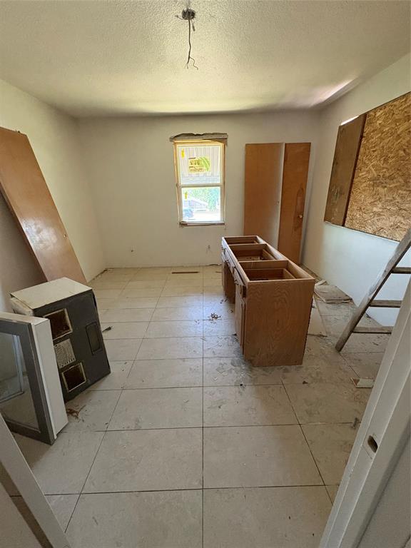 2306 Greenland Drive Dallas, TX 75228 - Photo 9 of 18 a living room with a couch and a window