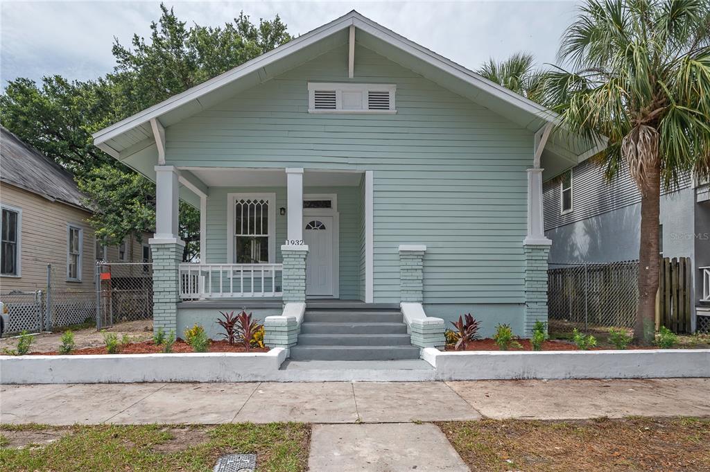 a front view of a house with garage