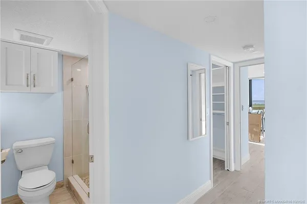 a view of an empty room with windows and city view