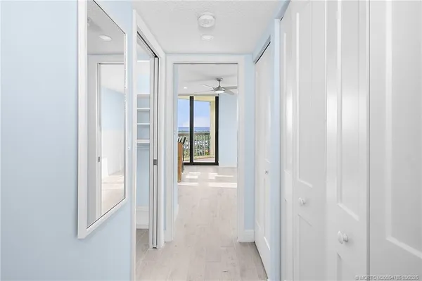 a view of a room with yard from a balcony