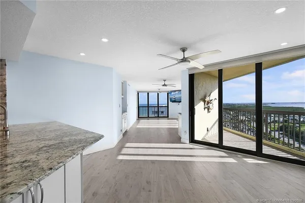 a kitchen with stainless steel appliances granite countertop a refrigerator sink and cabinets