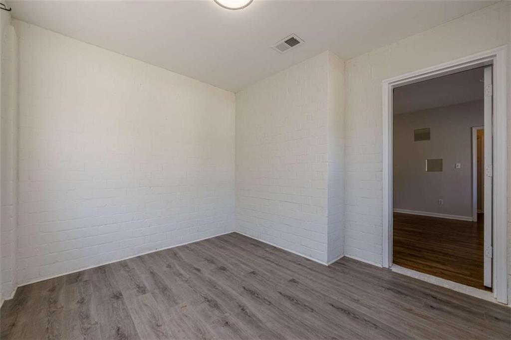 1977 North Decatur Road Atlanta, GA 30307 - Photo 19 of 59 a view of an empty room with wooden floor and closet