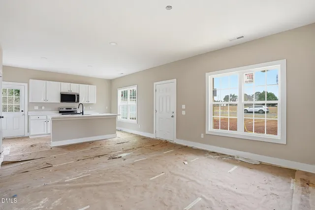 a view of kitchen with sink and cabinets