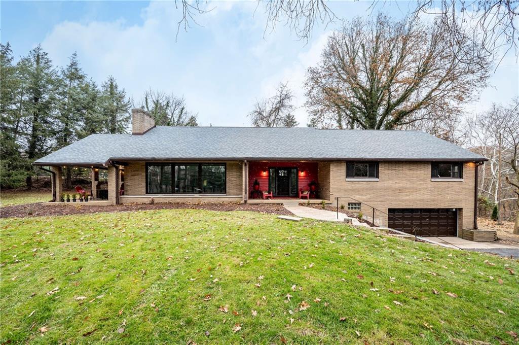 630 Bascom Avenue Pittsburgh, PA 15212 - Photo 1 of 25 front view of a house with swimming pool and a chairs and table in a patio