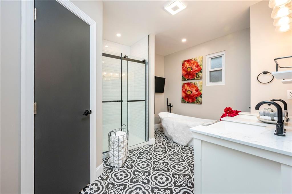 630 Bascom Avenue Pittsburgh, PA 15212 - Photo 14 of 25 a bathroom with a sink and a mirror