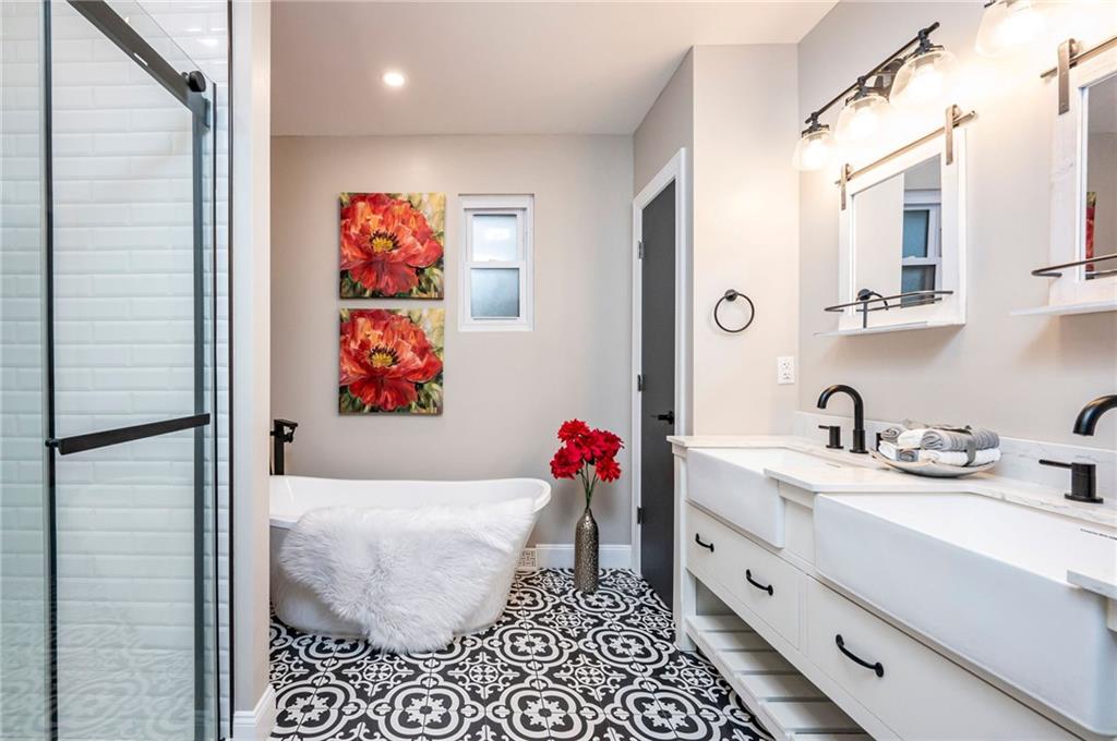 630 Bascom Avenue Pittsburgh, PA 15212 - Photo 15 of 25 a bathroom with a sink and a mirror