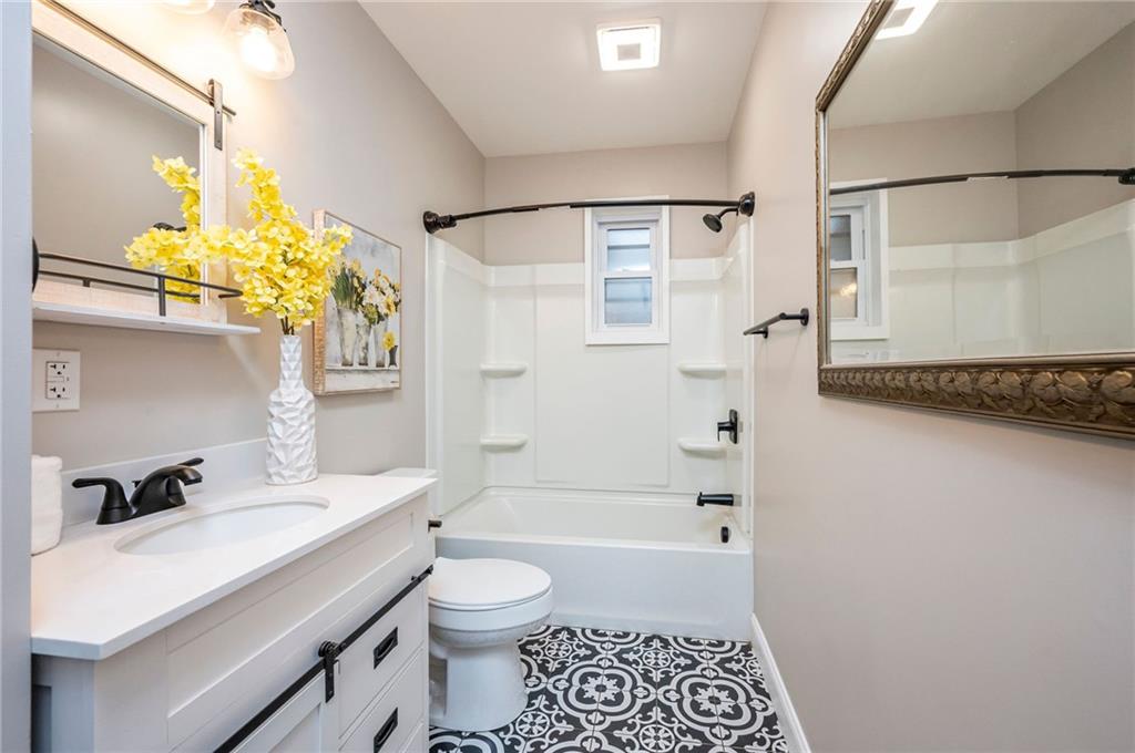 630 Bascom Avenue Pittsburgh, PA 15212 - Photo 17 of 25 a bathroom with a sink a toilet and shower