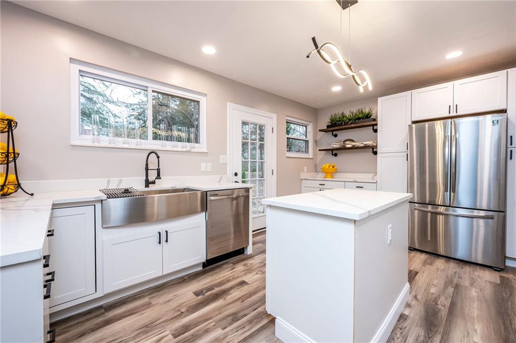 630 Bascom Avenue Pittsburgh, PA 15212 - Photo 8 of 25 a kitchen with a sink window and refrigerator