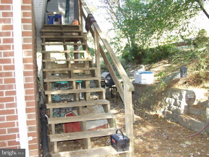 550 Remount Road Front Royal, VA 22630 - Photo 6 of 10 a view of staircase with a rug and a window