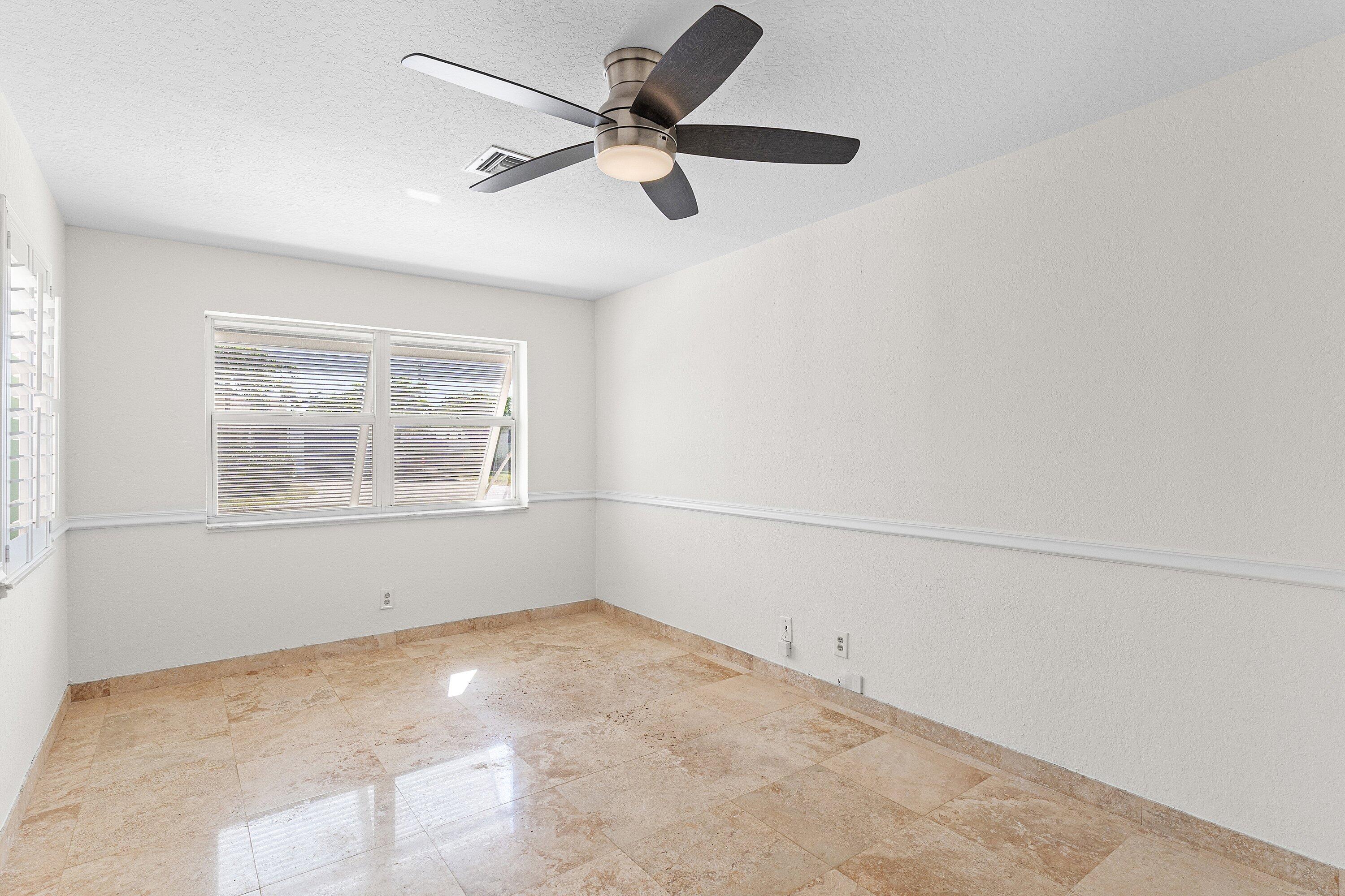 451 Northeast 25th Terrace Boca Raton, FL 33431 - Photo 18 of 47 a view of empty room with ceiling fan