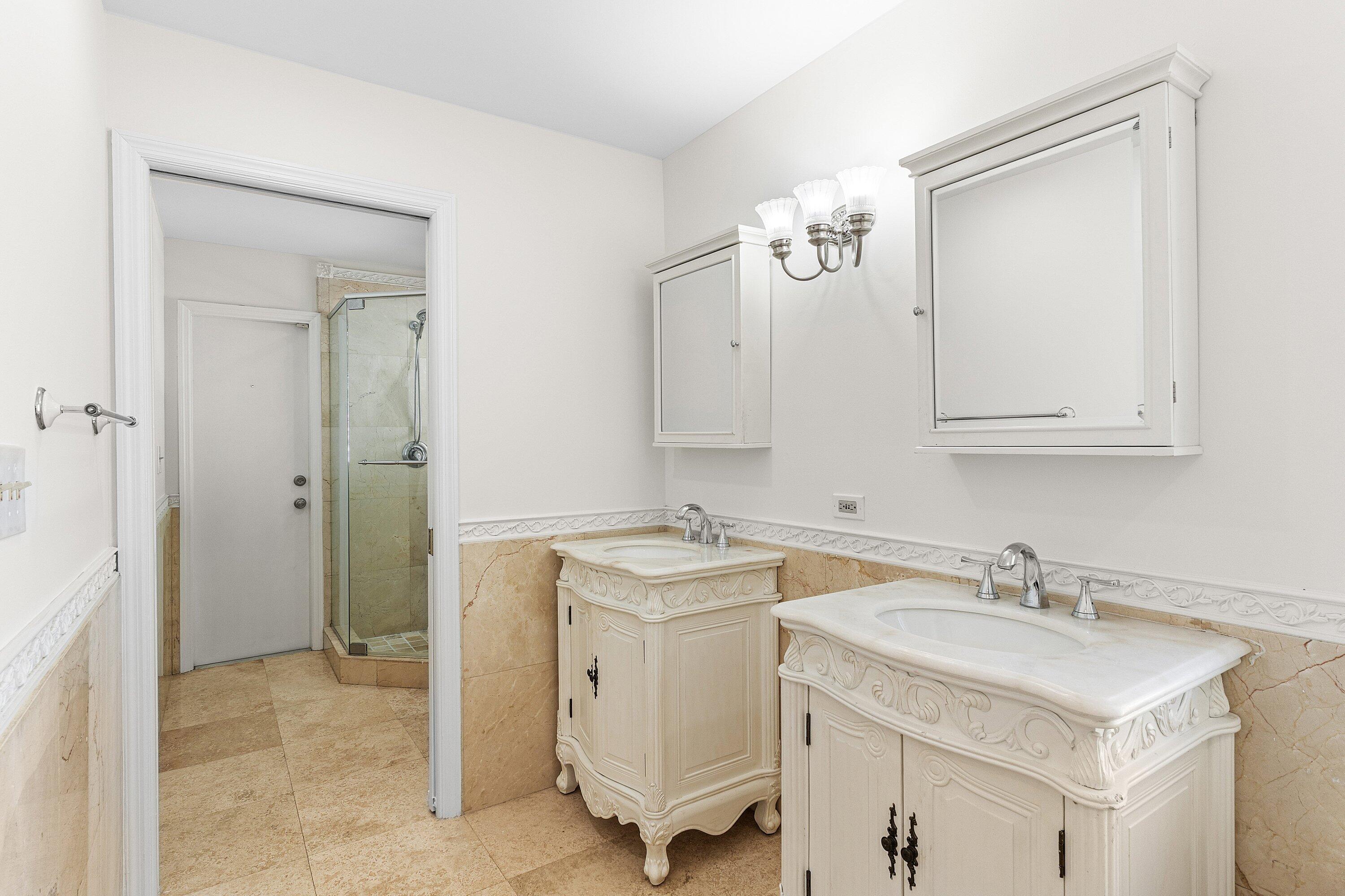 451 Northeast 25th Terrace Boca Raton, FL 33431 - Photo 24 of 47 a bathroom with a sink and a mirror