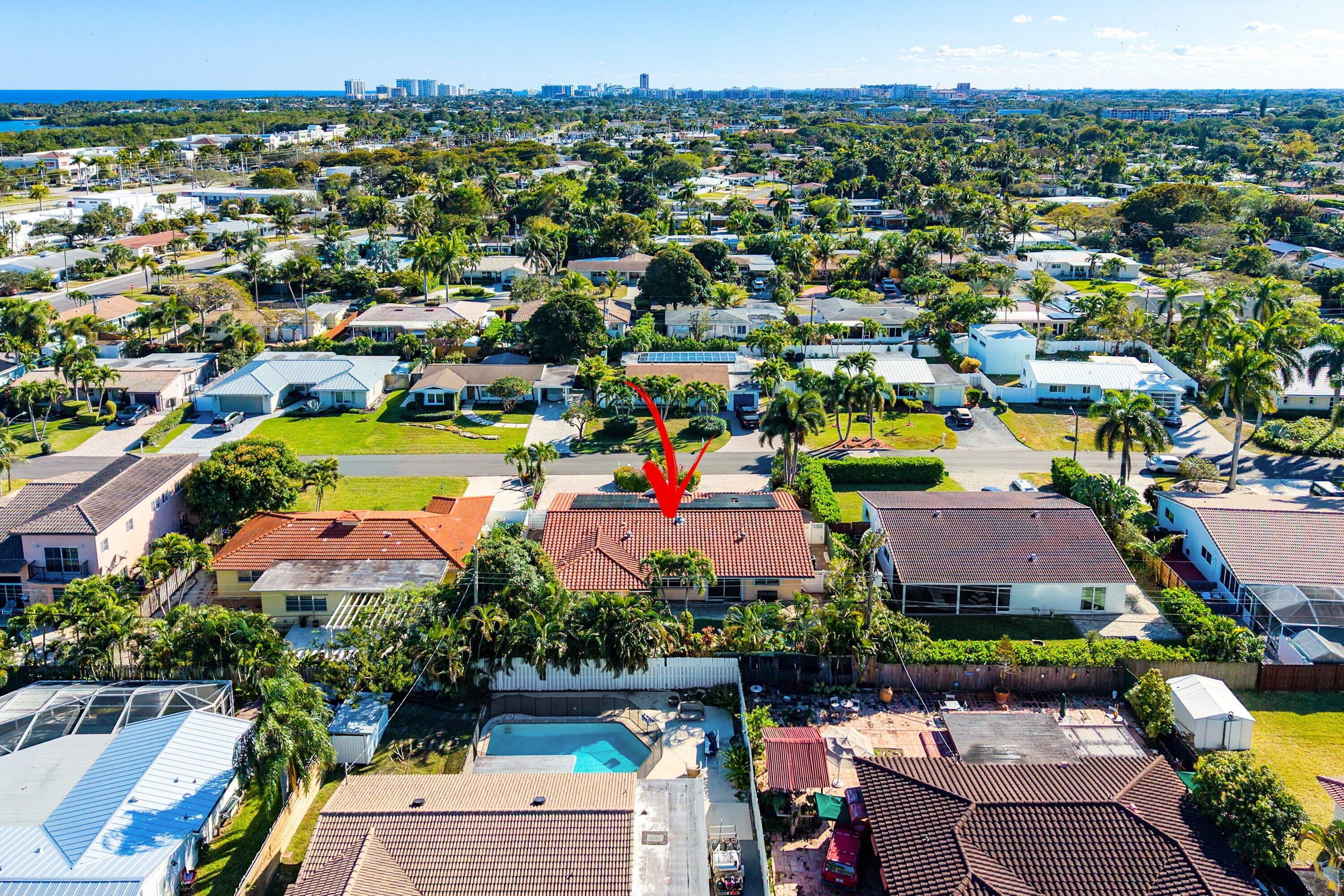 451 Northeast 25th Terrace Boca Raton, FL 33431 - Photo 38 of 47 an aerial view of a houses with a swimming pool