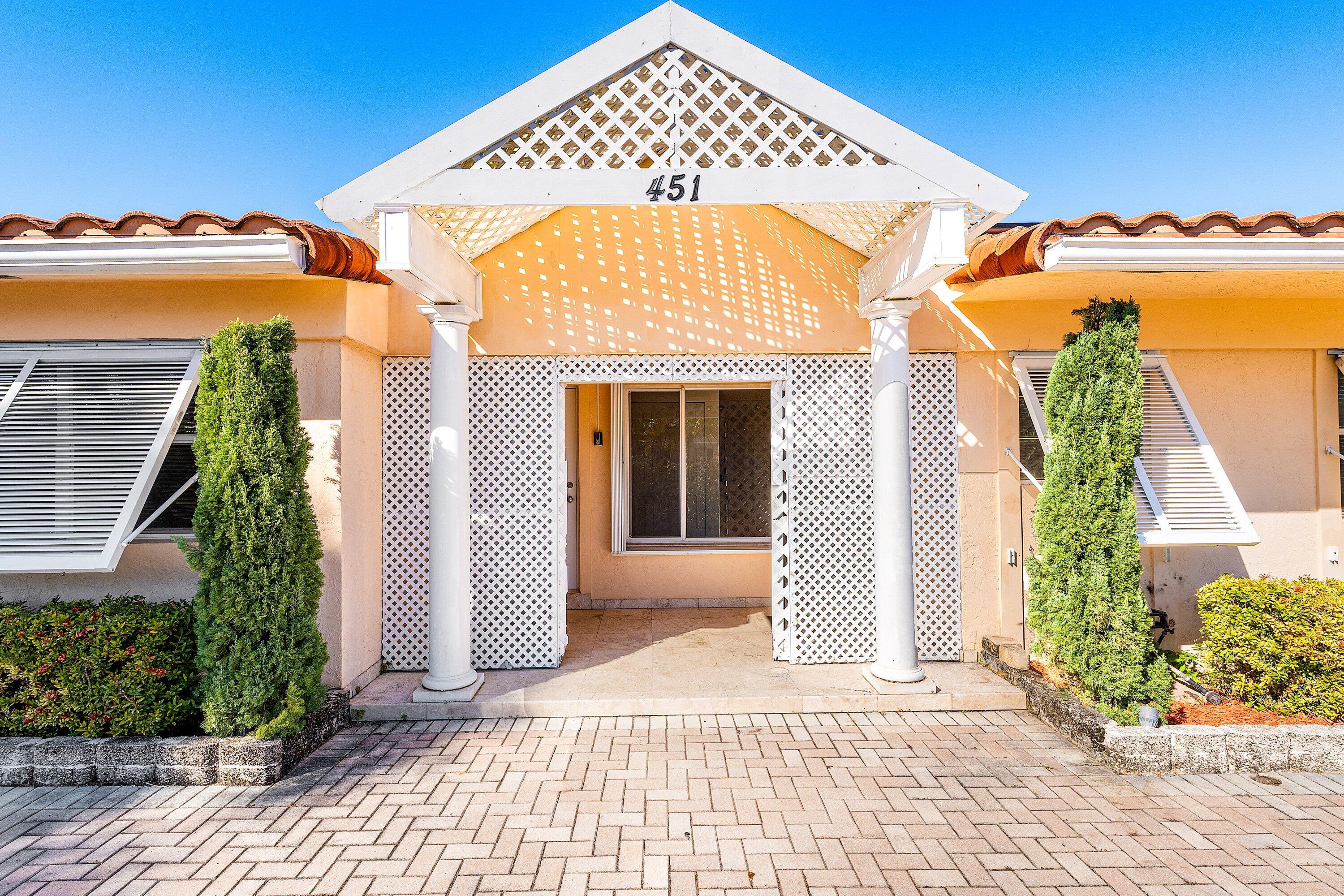451 Northeast 25th Terrace Boca Raton, FL 33431 - Photo 7 of 47 front view of a house
