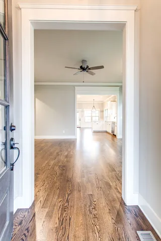 a view of a living room with a wooden floor