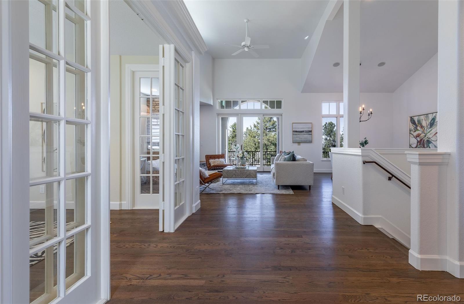 968 Summer Spring View Colorado Springs, CO 80906 - Photo 11 of 40 a view of a living room and a livingroom with furniture wooden floor