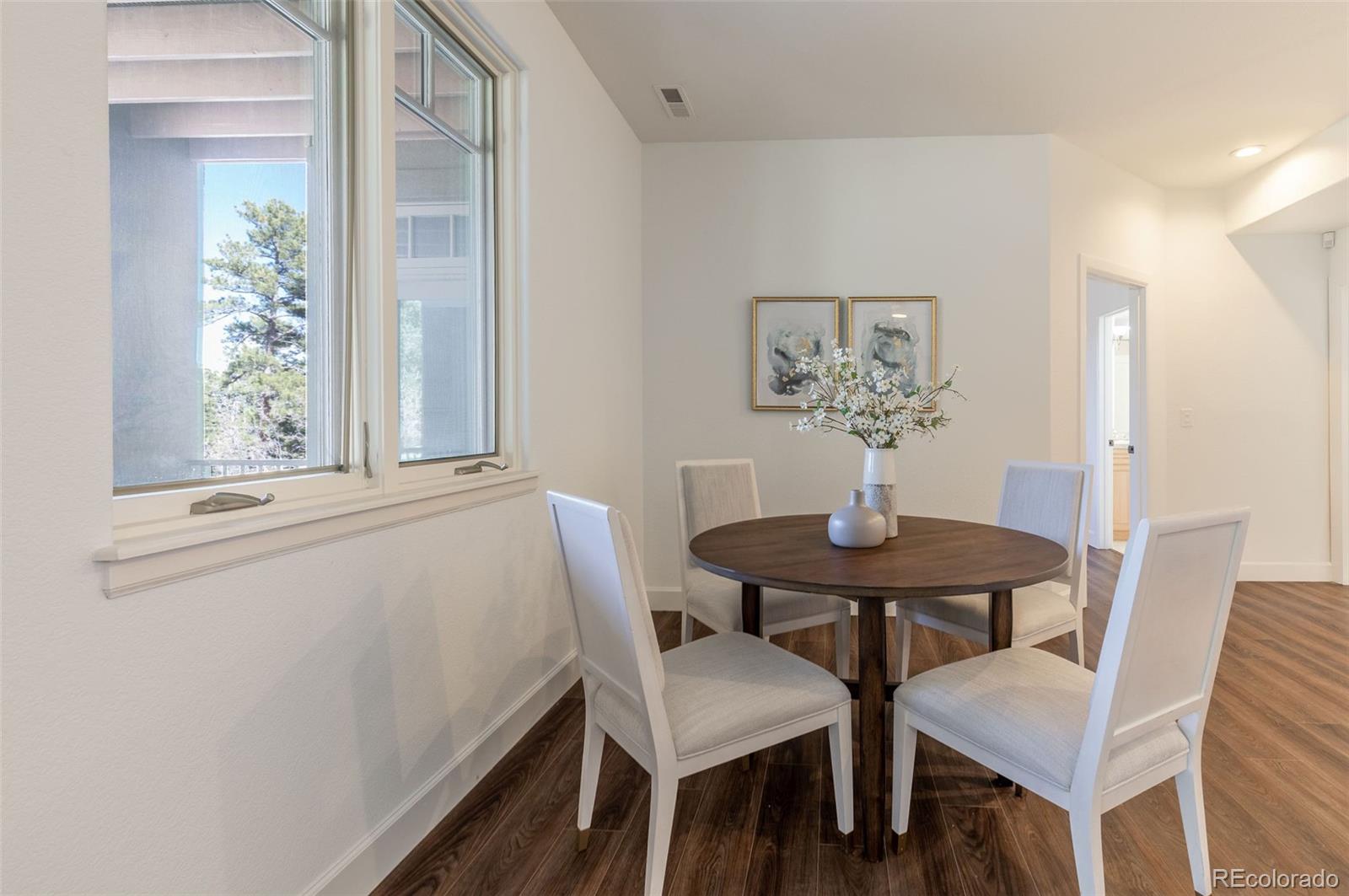 968 Summer Spring View Colorado Springs, CO 80906 - Photo 30 of 40 a view of a dining room with furniture and window