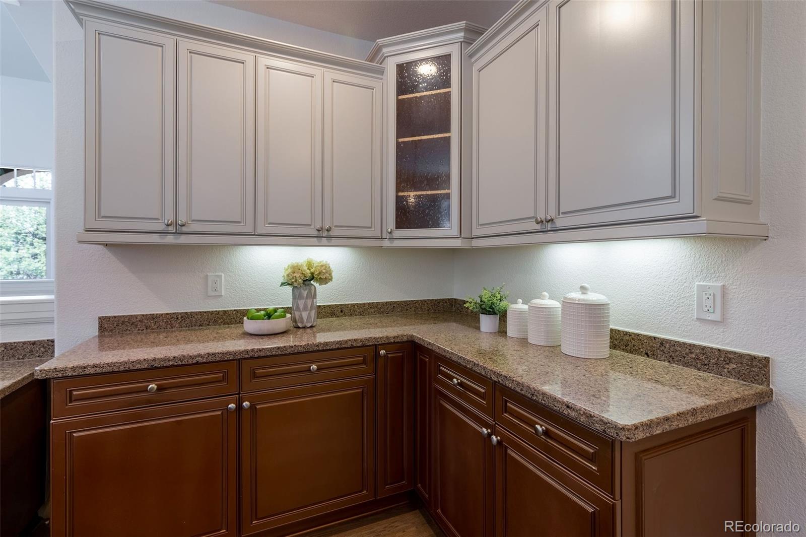 968 Summer Spring View Colorado Springs, CO 80906 - Photo 8 of 40 a kitchen with granite countertop cabinets sink and cabinets