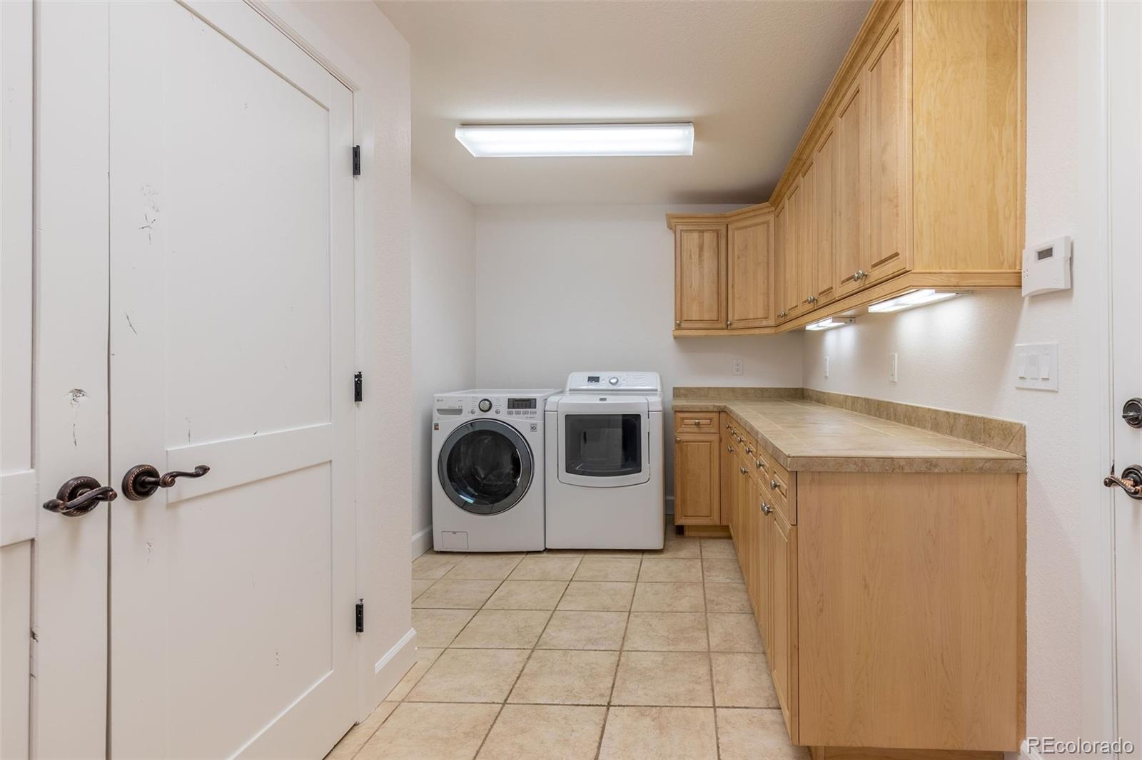 968 Summer Spring View Colorado Springs, CO 80906 - Photo 10 of 40 a utility room with dryer and washer
