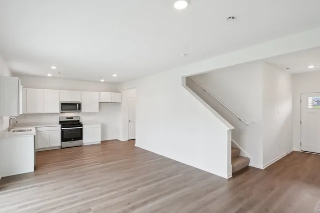 a view of kitchen with wooden floor