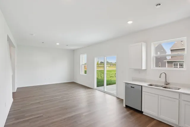 a kitchen with sink and cabinets