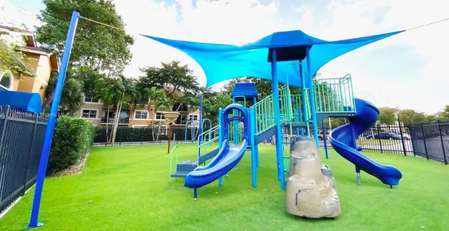 a view of a swimming pool with an outdoor seating
