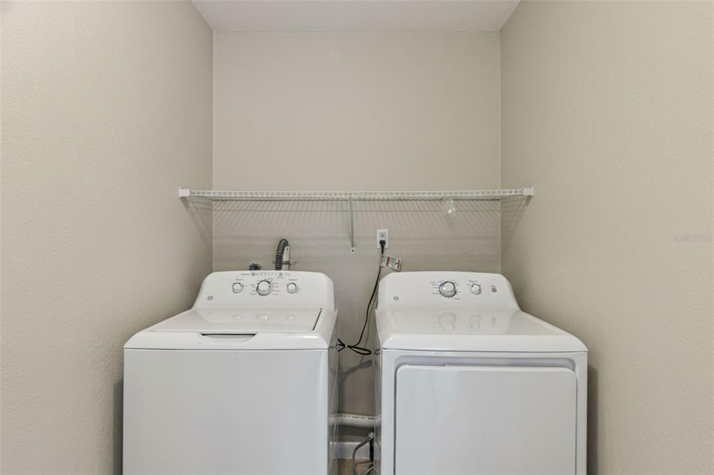 725 3rd Street Orange City, FL 32763 - Photo 11 of 15 a utility room with dryer and washer
