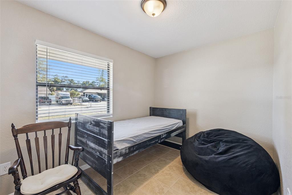 725 3rd Street Orange City, FL 32763 - Photo 12 of 15 a bedroom with a bed and window