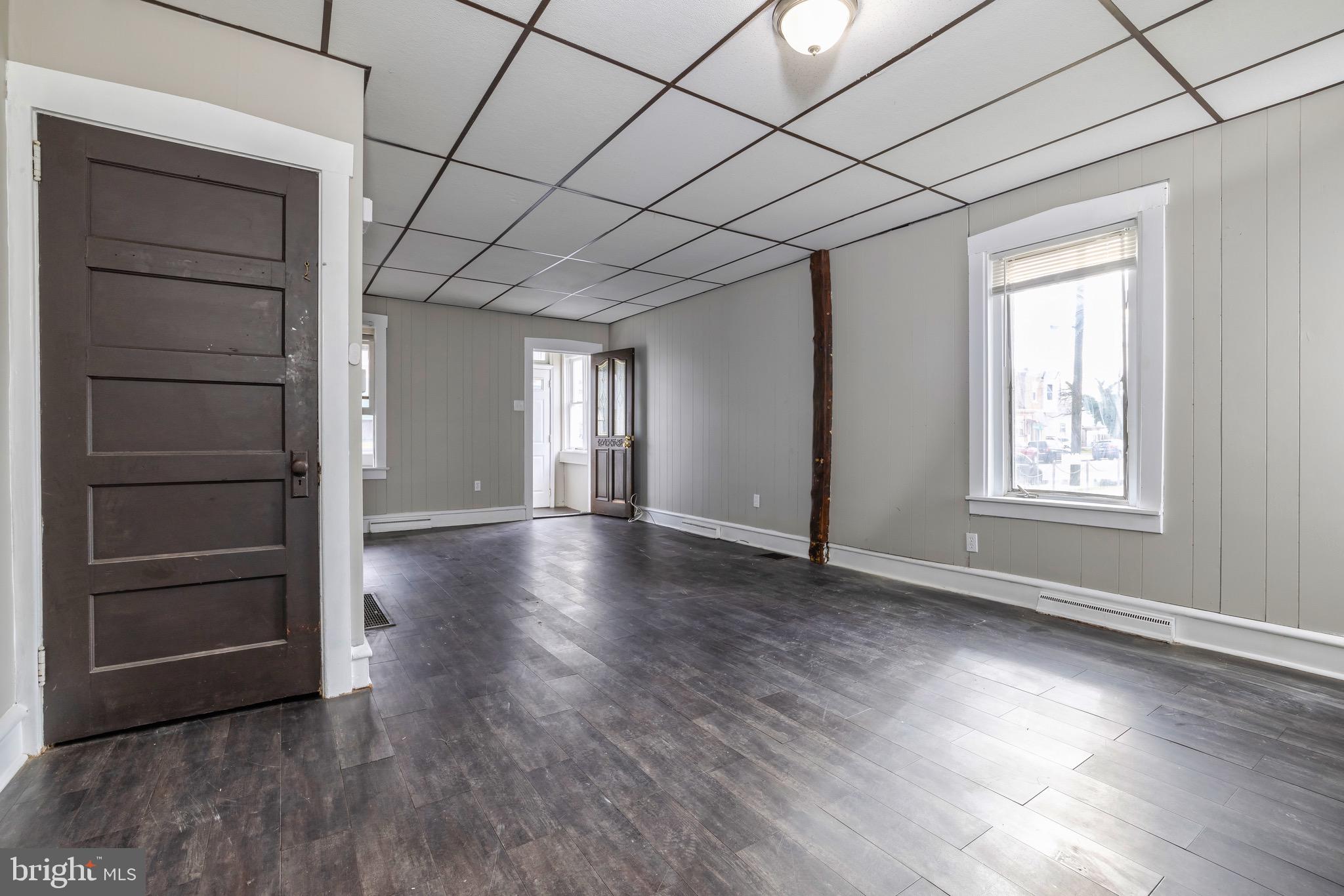 223 3rd Street Gloucester City, NJ 08030 - Photo 5 of 15 wooden floor in an empty room with a window